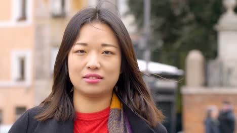 Chinese-Woman-Portrait:-Thoughtful-Young-Asian-Woman-Looking-In-Camera