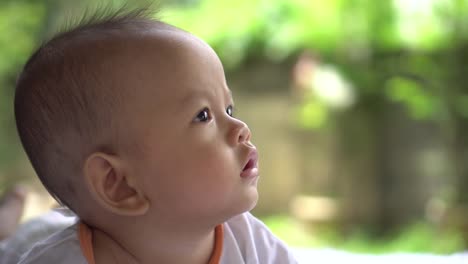 Happy-portrait-baby-boy-playing-alone