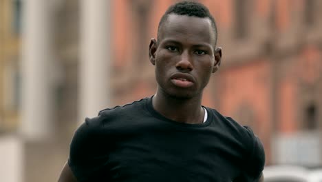 portarit-of-Proud-handsome-young-black-african-in-the-street,looking-at-camera