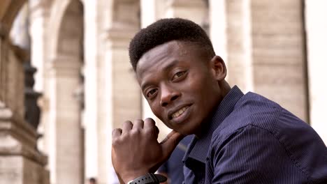 portrait-of-Confident-attractive-young-black-american-man-looking-at-camera--outdoor