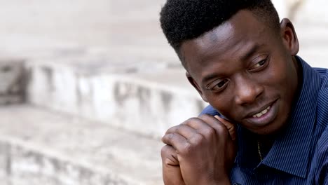 portrait-of-Confident-attractive-young-black-man-smiling-at-camera--outdoor