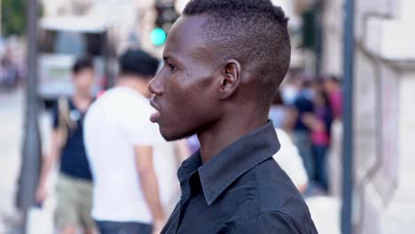 young-american-african-man-standing-in-the-street--profile--slow-motion