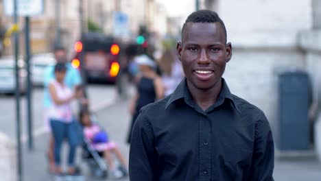 Happy-young-black-american-in-street-smiling-at-camera