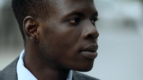 Handsome-Black-american-young-business-man-looking-around--outdoor