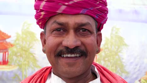 Handheld-close-up-of-a-man-talking-serious-on-his-cell-phone-in-Rajasthan