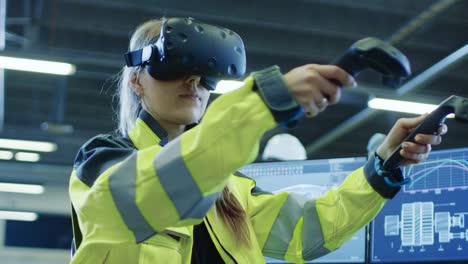 Factory:-Female-Industrial-Engineer-Wearing-Virtual-Reality-Headset-and-Holding-Controllers,-She-Uses-VR-technology-for-Industrial-Design,-Development-and-Prototyping-in-CAD-Software.