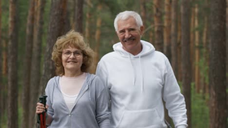 Happy-Elderly-People-Walking-in-Forest