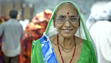 .-A-lady-worker-in-garment-factory-or-textile-workshop-looking-with-a-smile