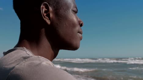 Migration,refugee,-Homeland.-Depressed-pensive-black-migrant-on-the-beach