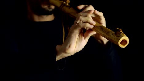man-playing-the-flute