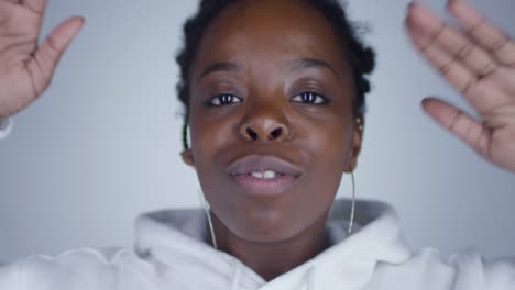 Joyous-Black-Woman-Dancing-and-Looking-at-Camera