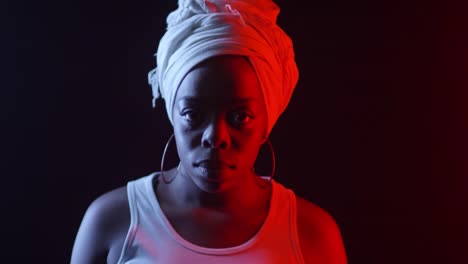 Black-Woman-in-Turban-Posing-in-Dark-Studio