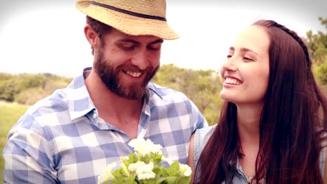 Happy-young-couple-gardening-together