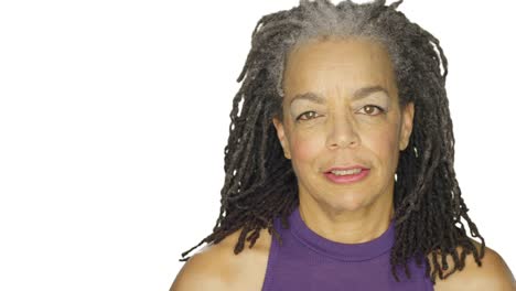 Mature-woman-stares,-on-a-white-studio-background