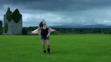 4k-Castle-in-Background-Shot-of-a-Woman-Spinning-Happy