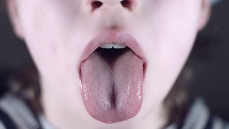 4k-Close-Up-Child-Showing-his-Tongue-to-Doctor