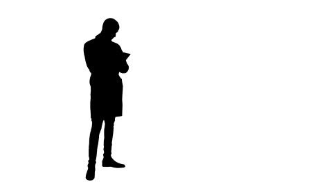 Silhouette-Young-male-doctor-using-digital-tablet