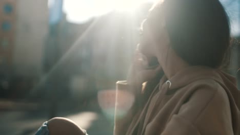 Portrait-of-young-African-American-woman-using-phone,-outdoors.