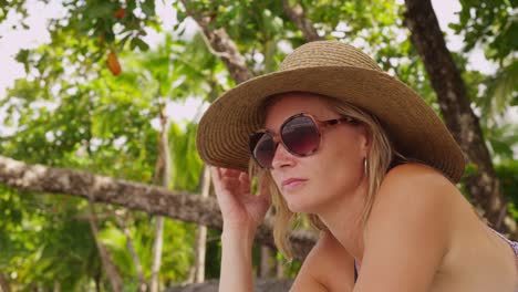 Woman-laying-on-tropical-beach.