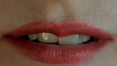 Extreme-close-up-of-lips-blowing-a-kiss-and-smiling