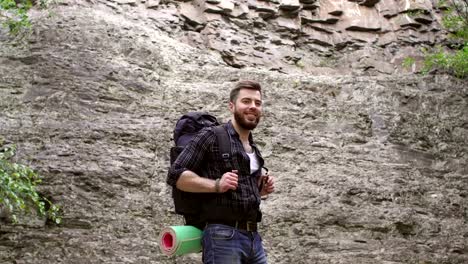 Close-up-of-male-hiker-with-backpack-in-mountains.