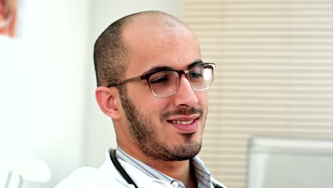 Smiling-male-doctor-taking-selfies-on-his-phone