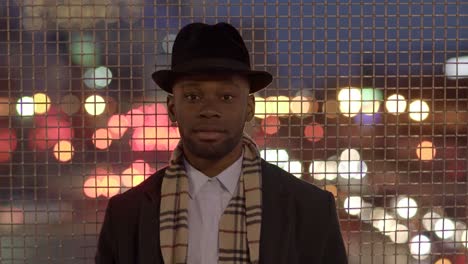 Young-Man-with-African-American-Ethnicity-Wearing-Old-Classic-Look.-Having-Fun-in-the-Big-City-with-Sunglasses,-Hat-and-Scarf.