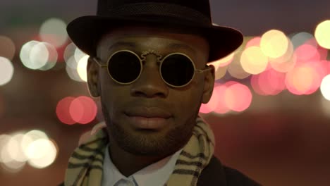 Young-Black-Men-Wearing-Sunglasses,-Hat-and-Scarf.-Enjoying-the-Day-Outdoors-in-the-City