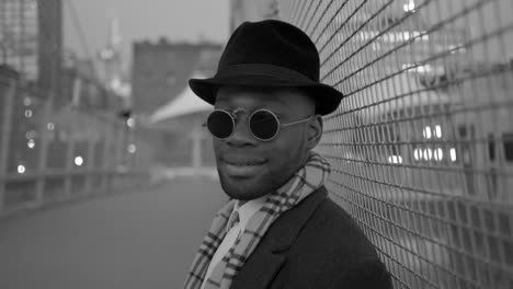 Young-Black-Men-Wearing-Sunglasses,-Hat-and-Scarf.-Enjoying-the-Day-Outdoors-in-the-City