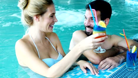 Picture-of-happy-couple-relaxing-in-pool