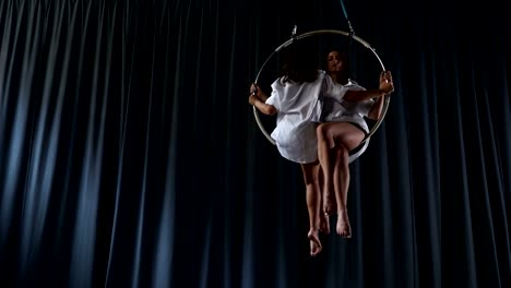 Young-girls-is-spinning-in-the-aerial-hoop