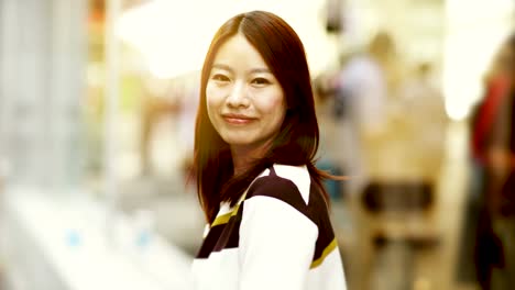 Attractive-Chinese-Woman-in-Urban-Environment.-Looking-at-the-Camera-with-Dark-Eyes-and-Dyed-Hair.