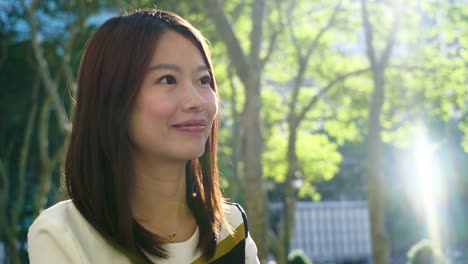 Attractive-Chinese-Woman-in-Urban-Environment.-Looking-at-the-Camera-with-Dark-Eyes-and-Dyed-Hair.