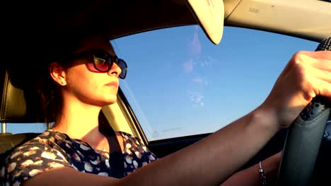 Drive.-Decided-thirty-year-old-woman-driving-during-sunset-time