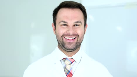 Portrait-of-Smiling-Positive-Doctor-in-Clinic