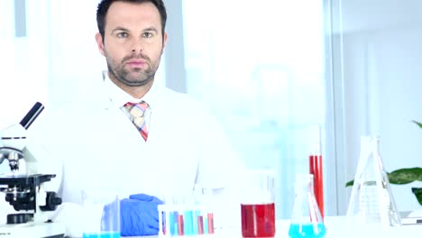 Serious-Scientist-Sitting-in-Chemical-Laboratory,-Microscope