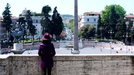 A-young,-elegant-tourist-looks-out-over-Piazza-del-Popolo-in-Rome