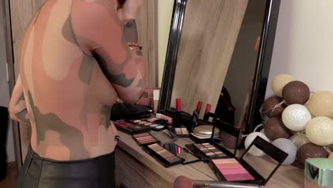 Woman-apply-makeup-near-mirror