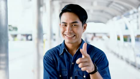 Portrait-Asian-handsome-man-looking-at-the-camera-and-smiling