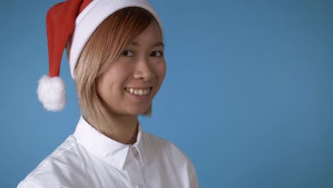 beautiful-girl-christmas-hat-looking-camera