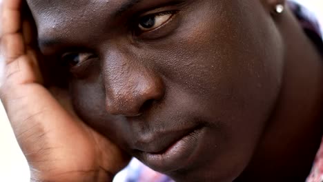 Close-up-on-pensive-daydreaming-young-black-african-man