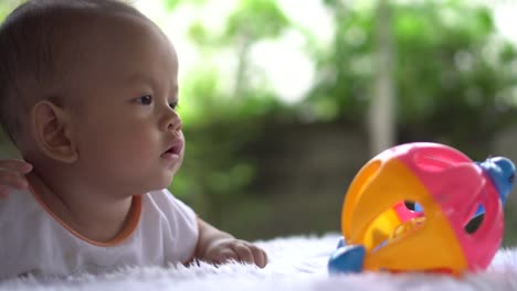 Happy-portrait-baby-boy-playing-alone