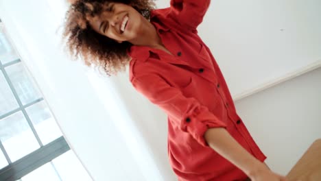 Portrait-of-happy-cheerful-young-afro-american-woman-at-home.