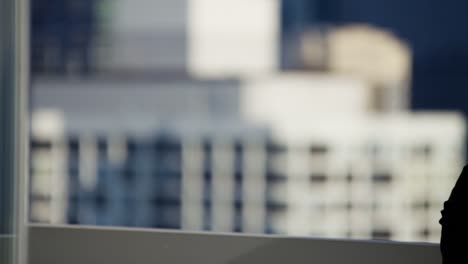 Portrait-of-Latin-American-businesswoman-on-city-rooftop