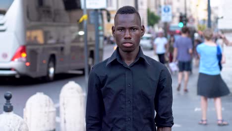 Confident-young-black-american-man-in-the-street-crossing-arms--slow-motion