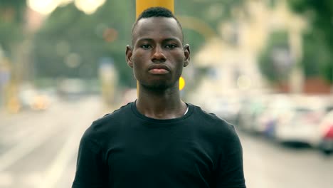 Confident-proud--African-youn-man-in-the-street-looking-at-camera