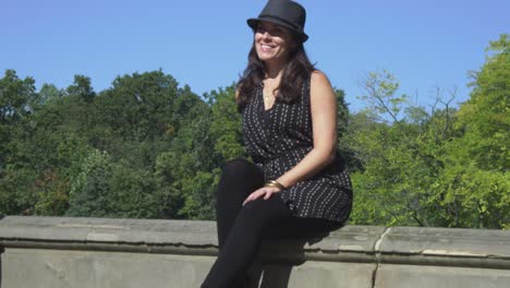 Slow-motion-of-woman-smiling-while-sitting-in-Central-Park,-NY