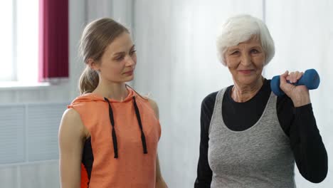 Personal-Fitness-Trainer-and-Senior-Woman-Posing