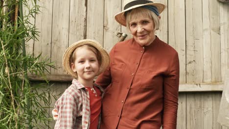 Grandmother-and-Granddaughter-Posing-in-Garden