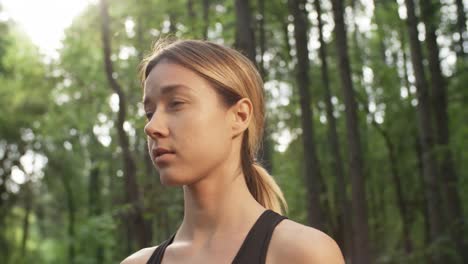 Woman-Basking-in-Sunlight-in-Forest